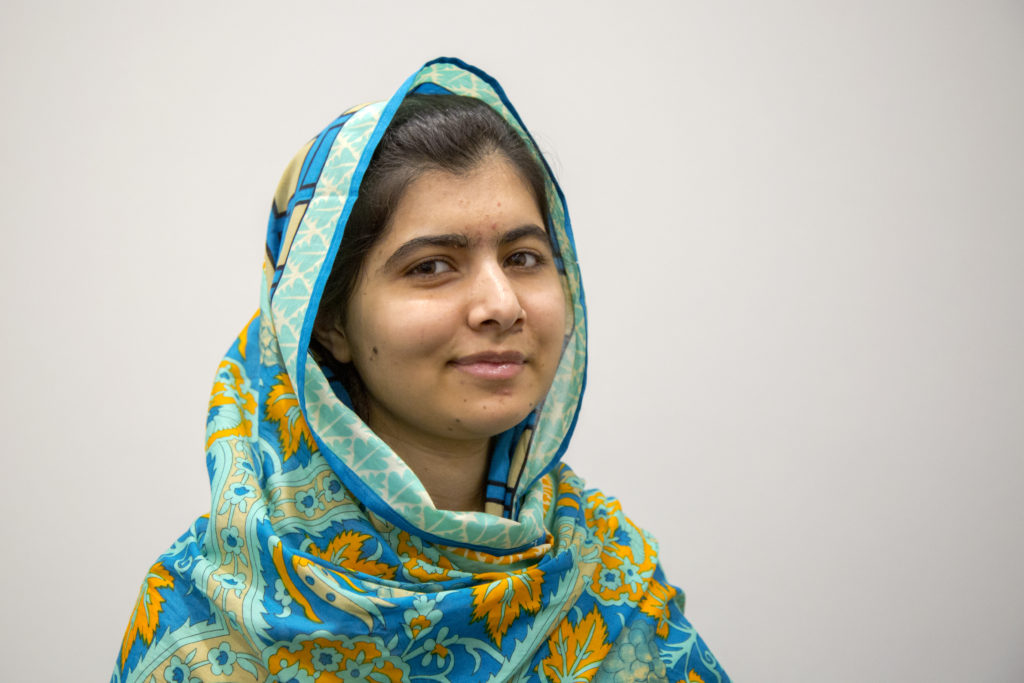 Portrait of Malala Yousafzai against white background