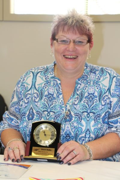 Sharon with a volunteer award