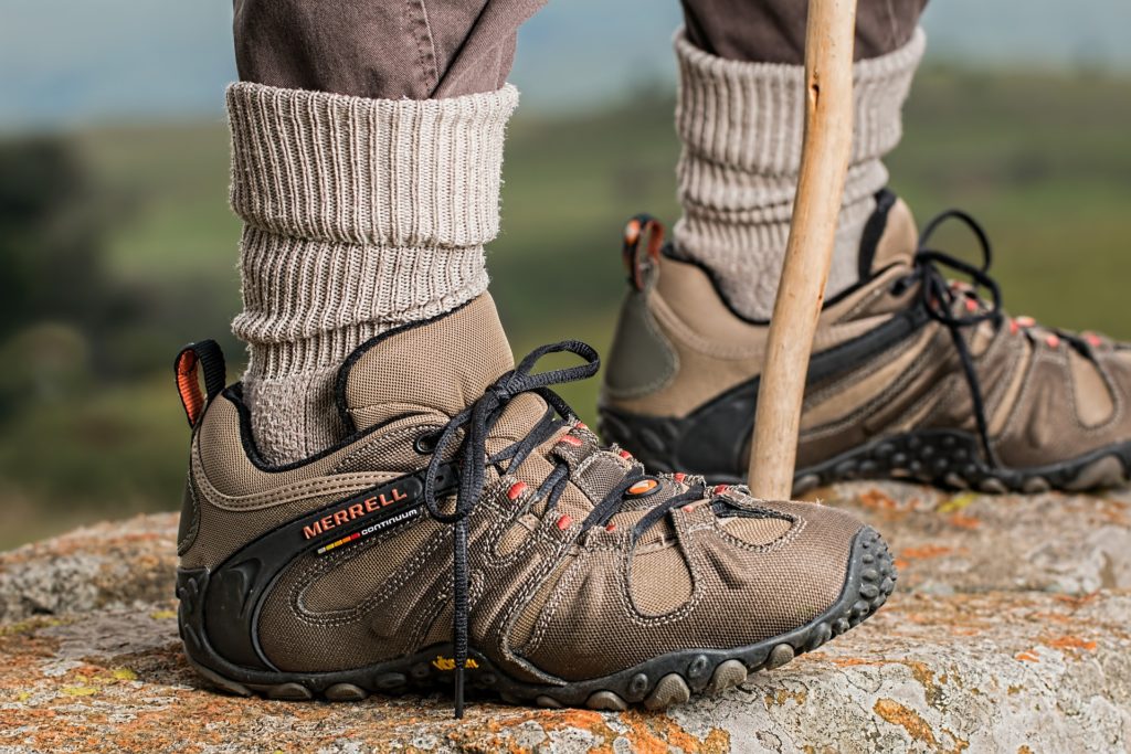 Feet of hiker up a mountain in hiking shoes