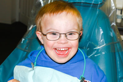 Young child with down syndrome in dental chair