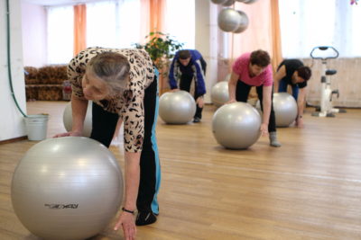 People exercise with balls
