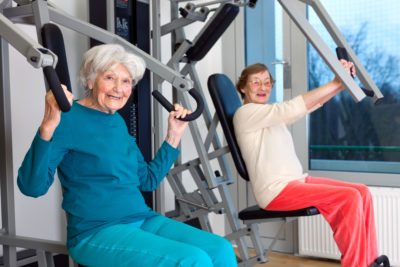 Older women using gym equipment
