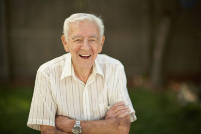 Smiling older man in the garden