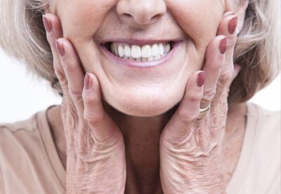 dentures, woman smiling.