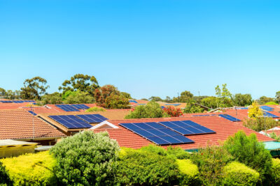 Suburban houses with solar panels on the roofs